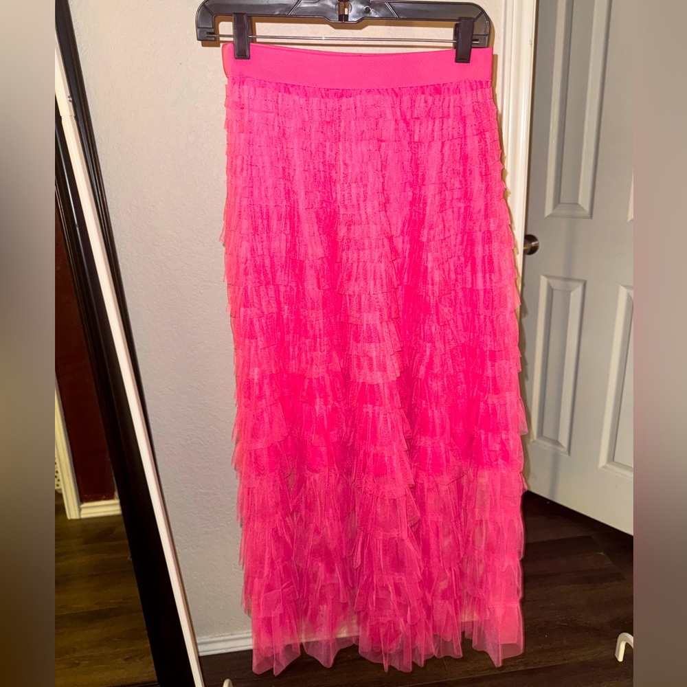 Hot pink maxi skirt. Has a slip to the knee and see thru from the knee down.